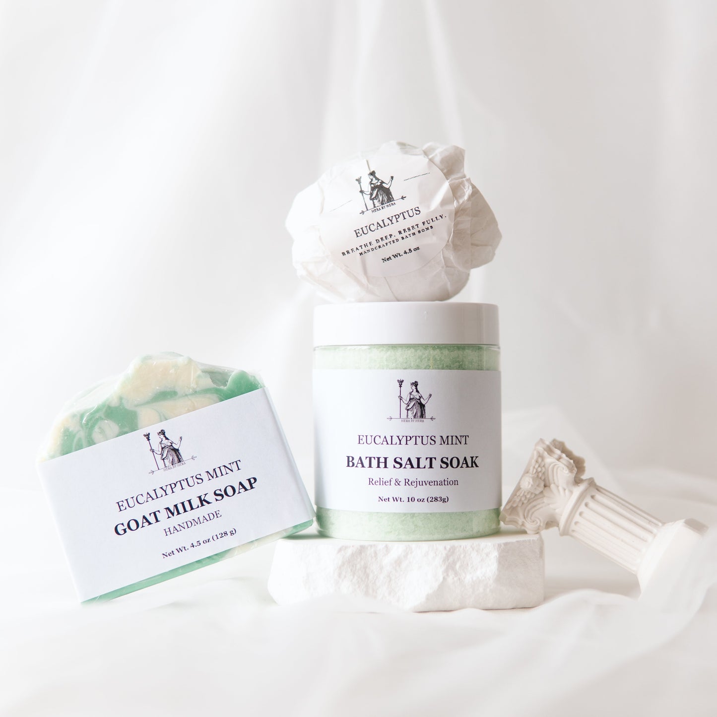 Eucalyptus Epsom Salt Bath Set with bath salts, bath bomb, and goat milk soap on a white background.
