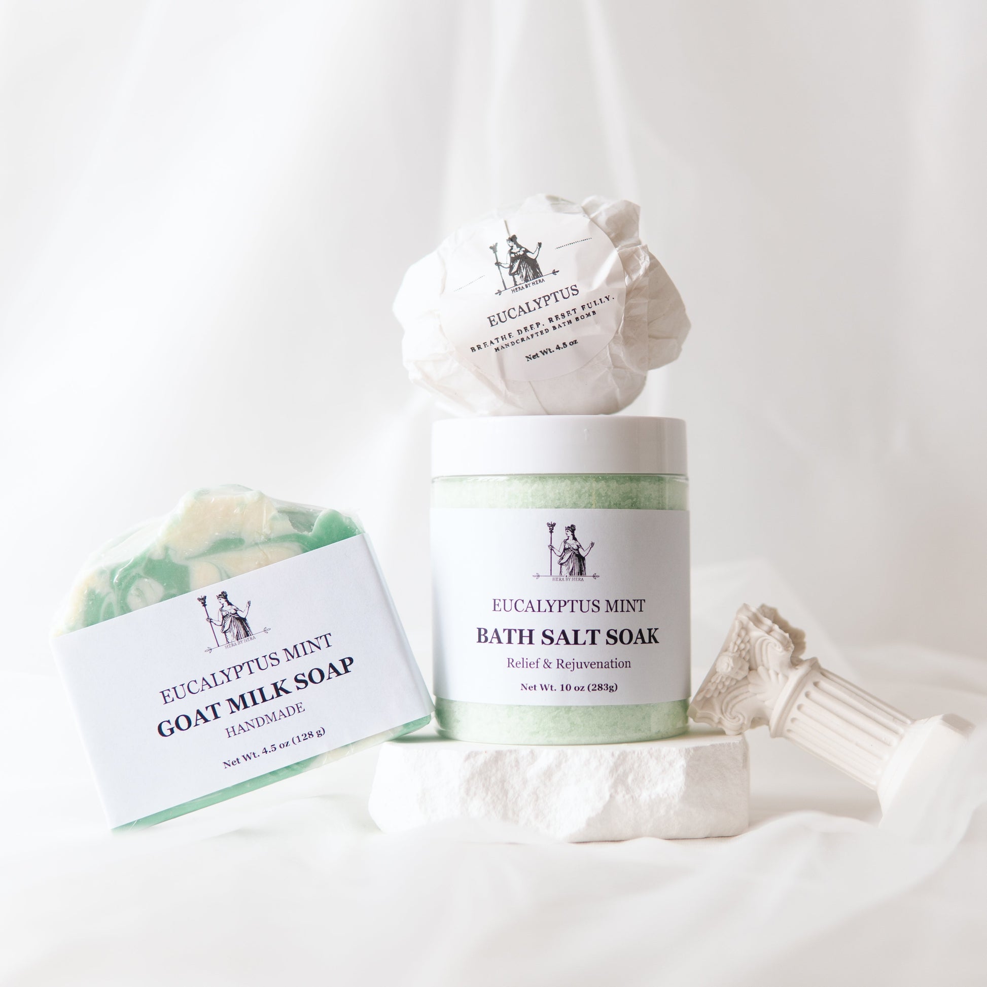 Eucalyptus Epsom Salt Bath Set with bath salts, bath bomb, and goat milk soap on a white background.