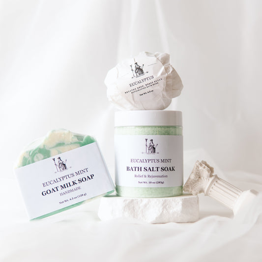 Eucalyptus Epsom Salt Bath Set with bath salts, bath bomb, and goat milk soap on a white background.