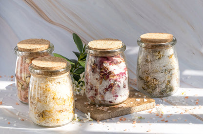 Epsom salt botanical bath soak gift set with glass jars and dried florals.