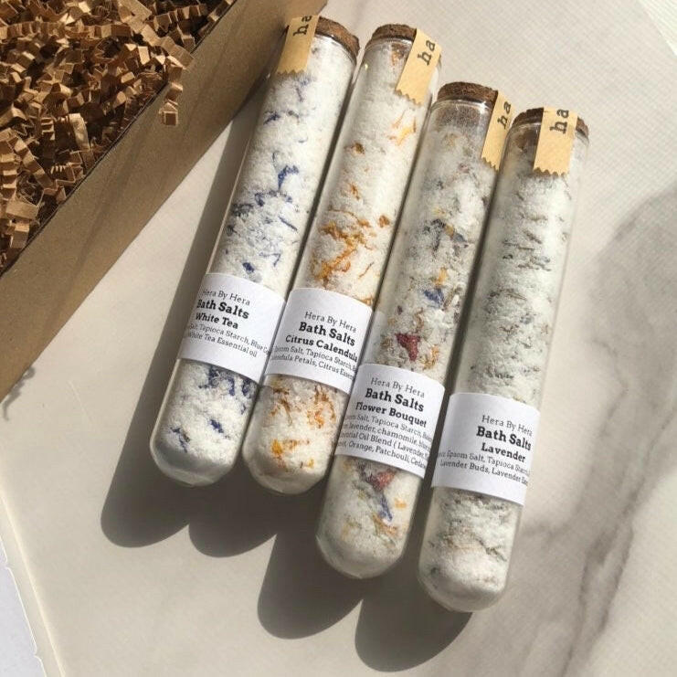The Explorer Set with 4 mini bath salt soaks in glass tubes, floral-infused for luxurious Epsom salt bathing.